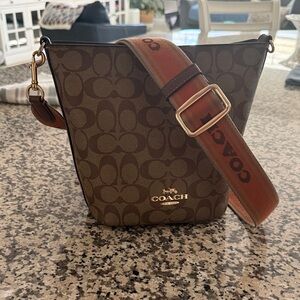 Coach Signature Brown Crossbody Bag with Red Strap